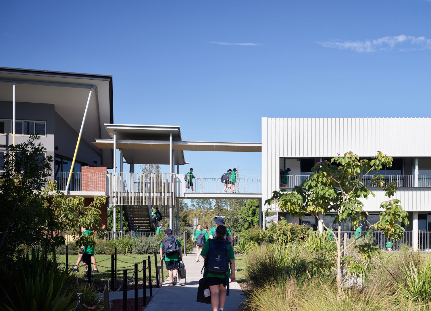 Students walking into the school grounds.