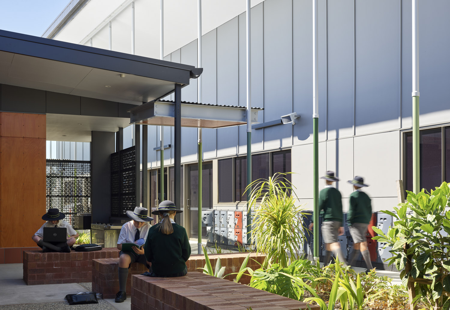 Students sitting outside in breakout spaces.